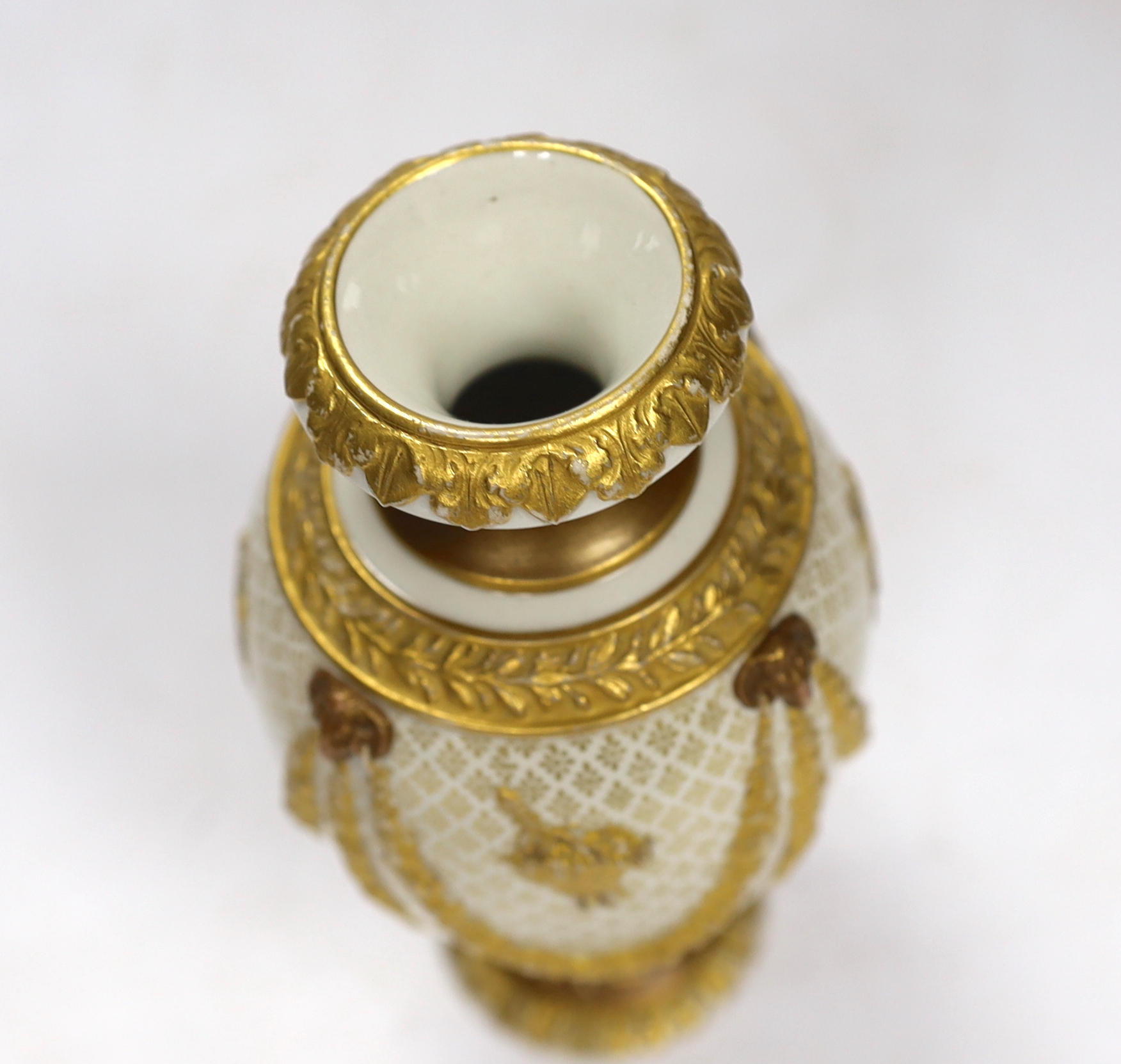 An early 20th century Wedgwood Adam style small gilt porcelain vase, 15cm